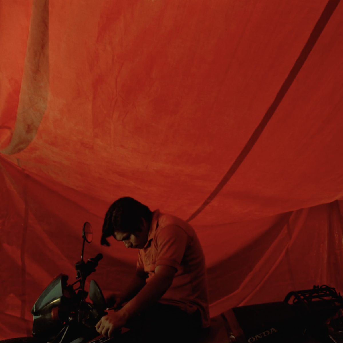 Motorcyclist's happiness wont fit into his suit