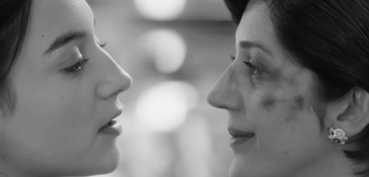 Two People Exchanging Saliva